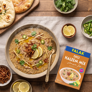 Degi haleem topped with lemon and fried onions, with a box of Falak Degi Haleem Mix